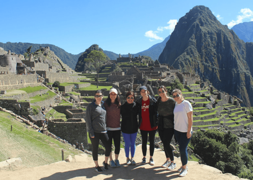 Students standing in front of machu picchu 